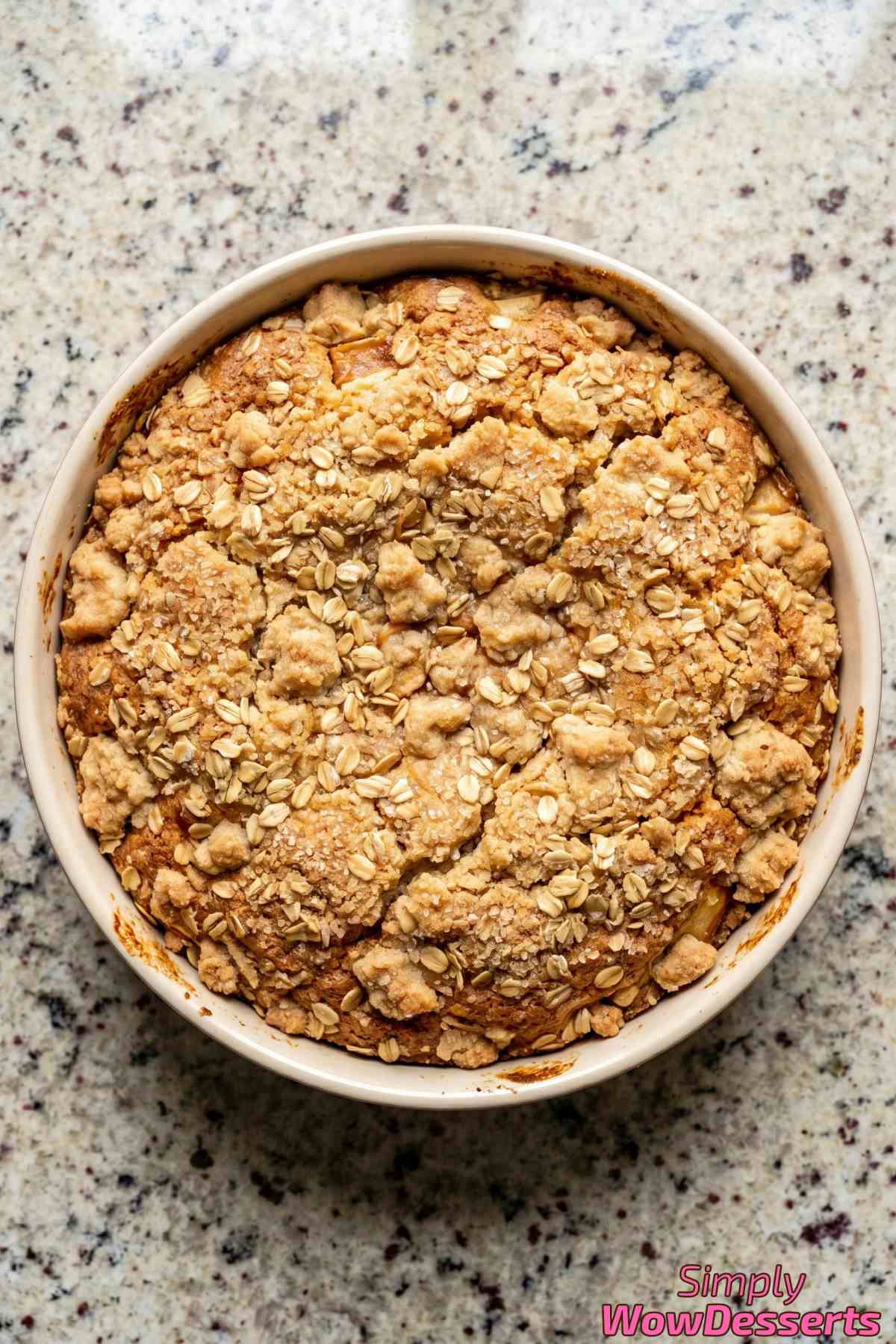 Freshly baked apple crumble cake close-up