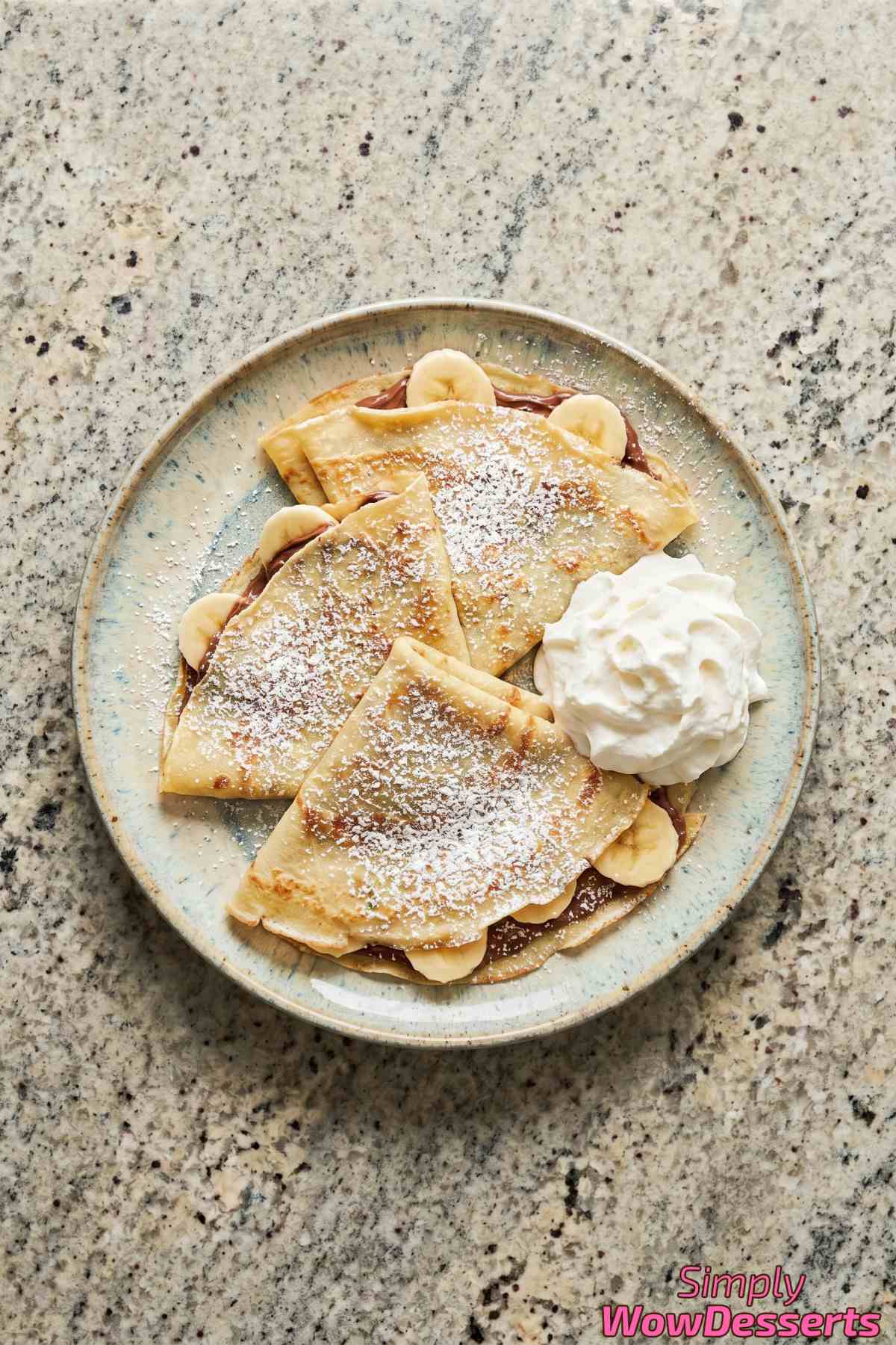 Sweet Nutella banana crepes with fresh slices