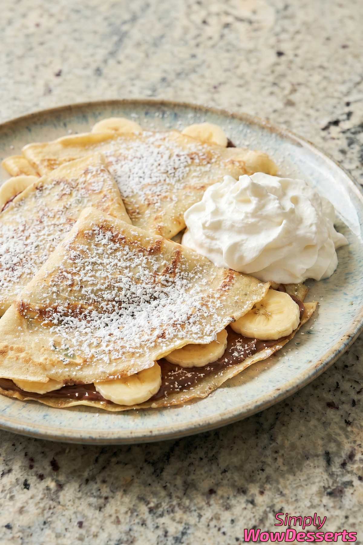 Soft Nutella banana crepes drizzled with chocolate