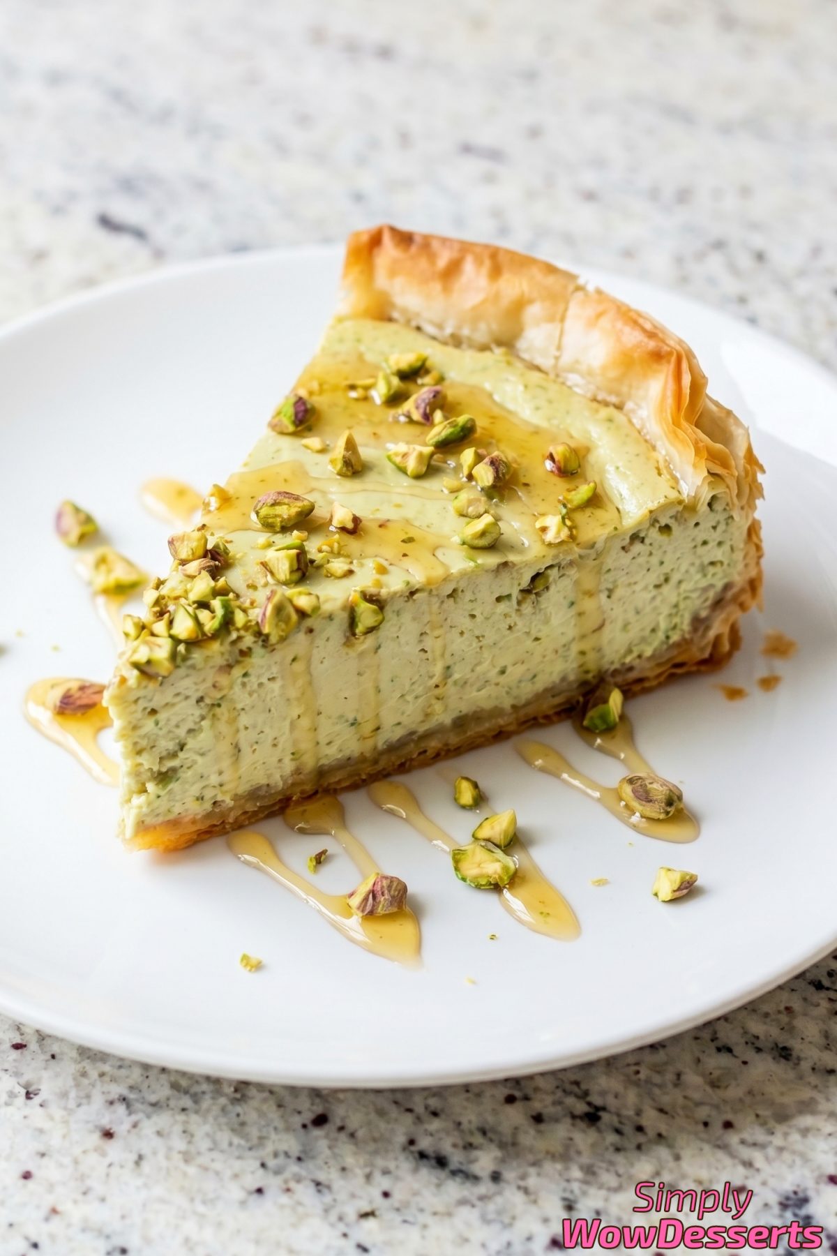 Flaky pistachio baklava cheesecake close-up