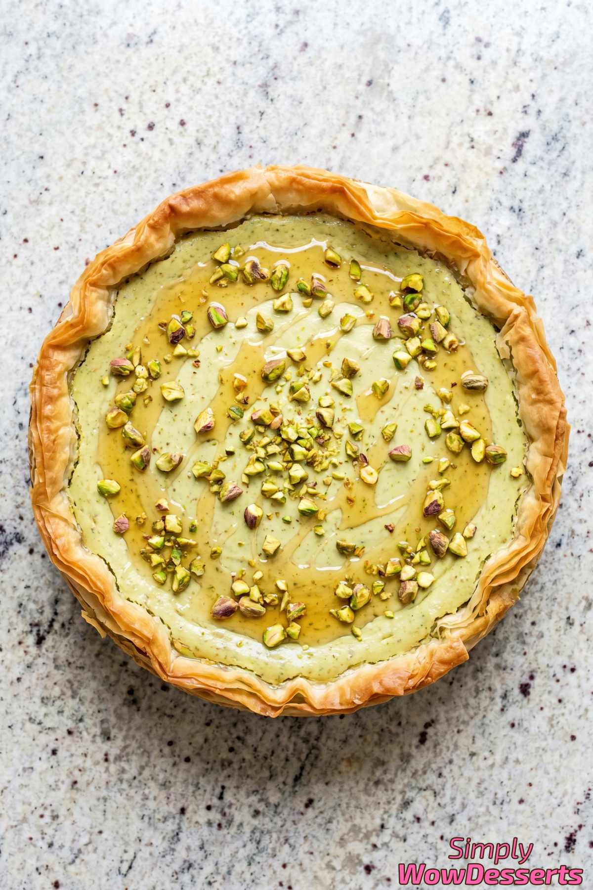 Nutty pistachio baklava cheesecake on plate