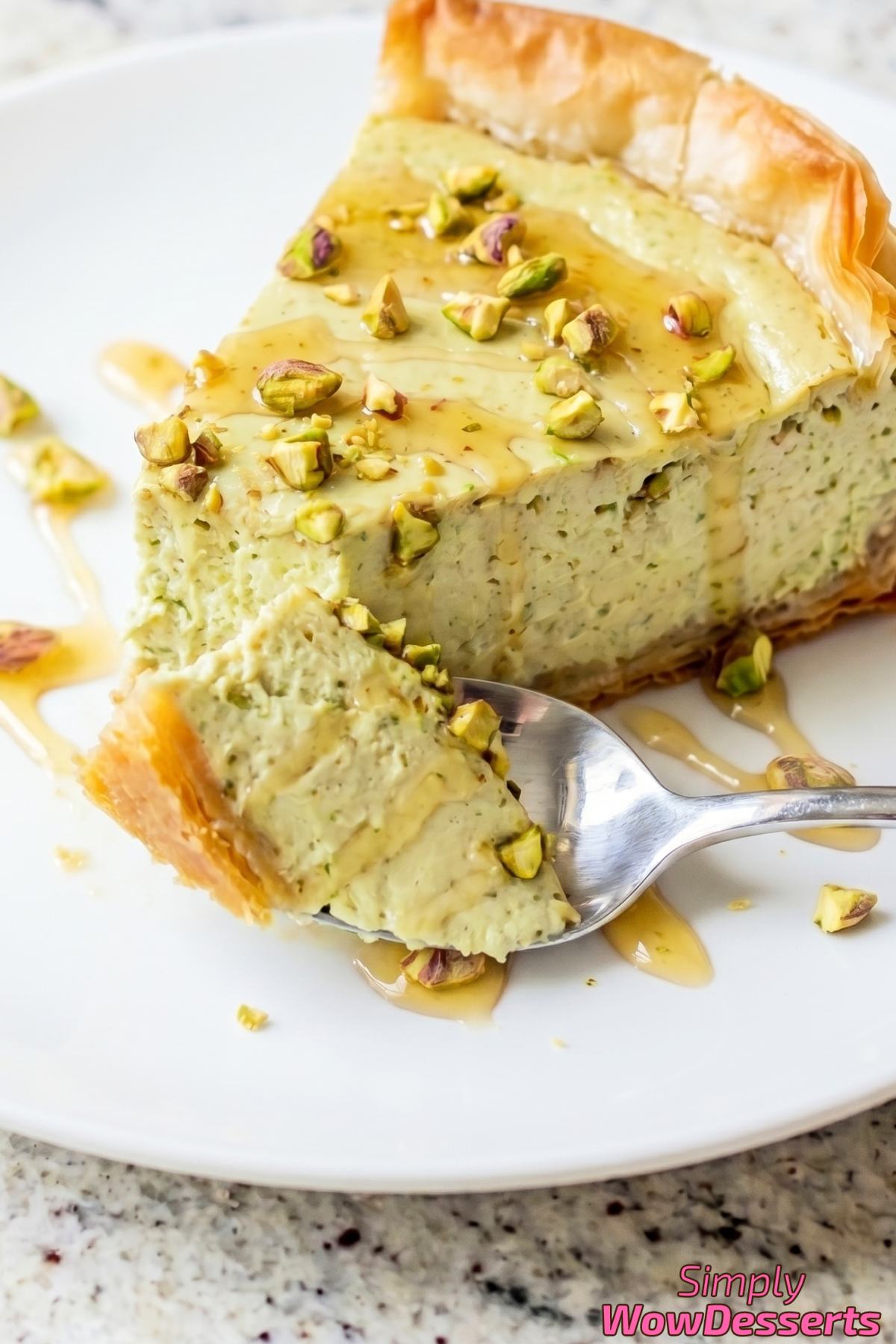 Layered pistachio baklava cheesecake dessert