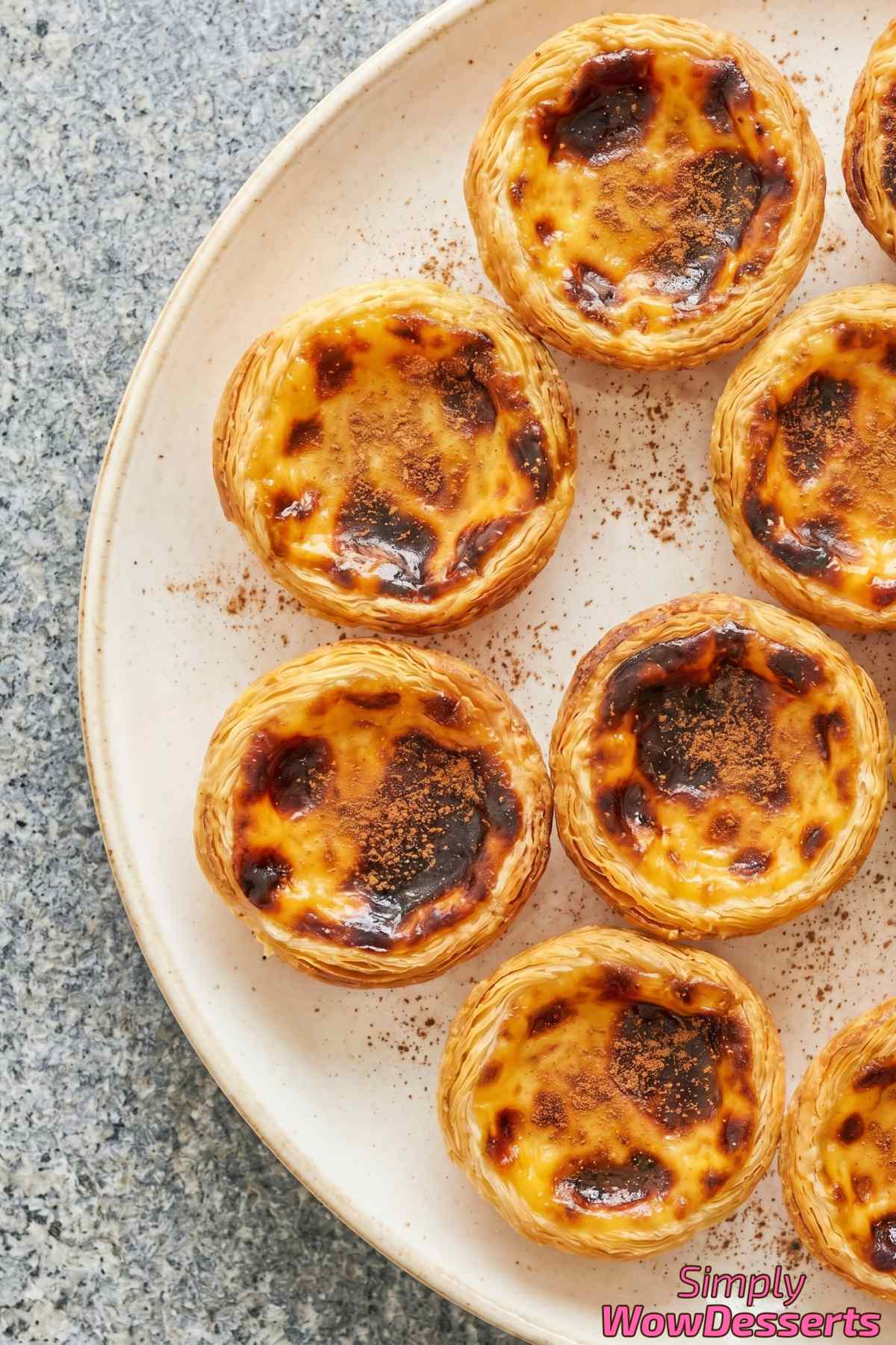 Authentic Portuguese custard tarts with caramelized tops