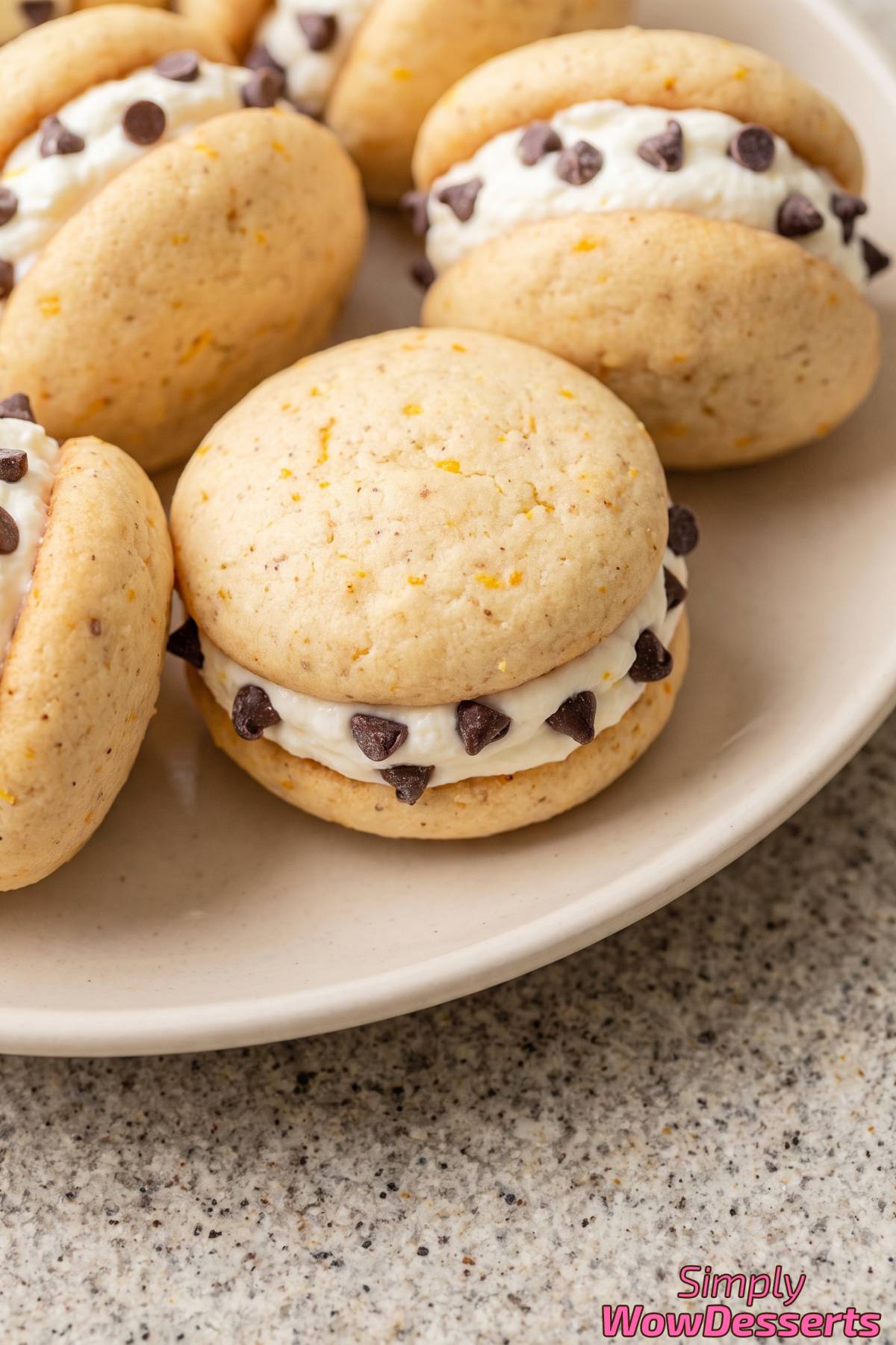 Cannoli cookies stacked on a plate