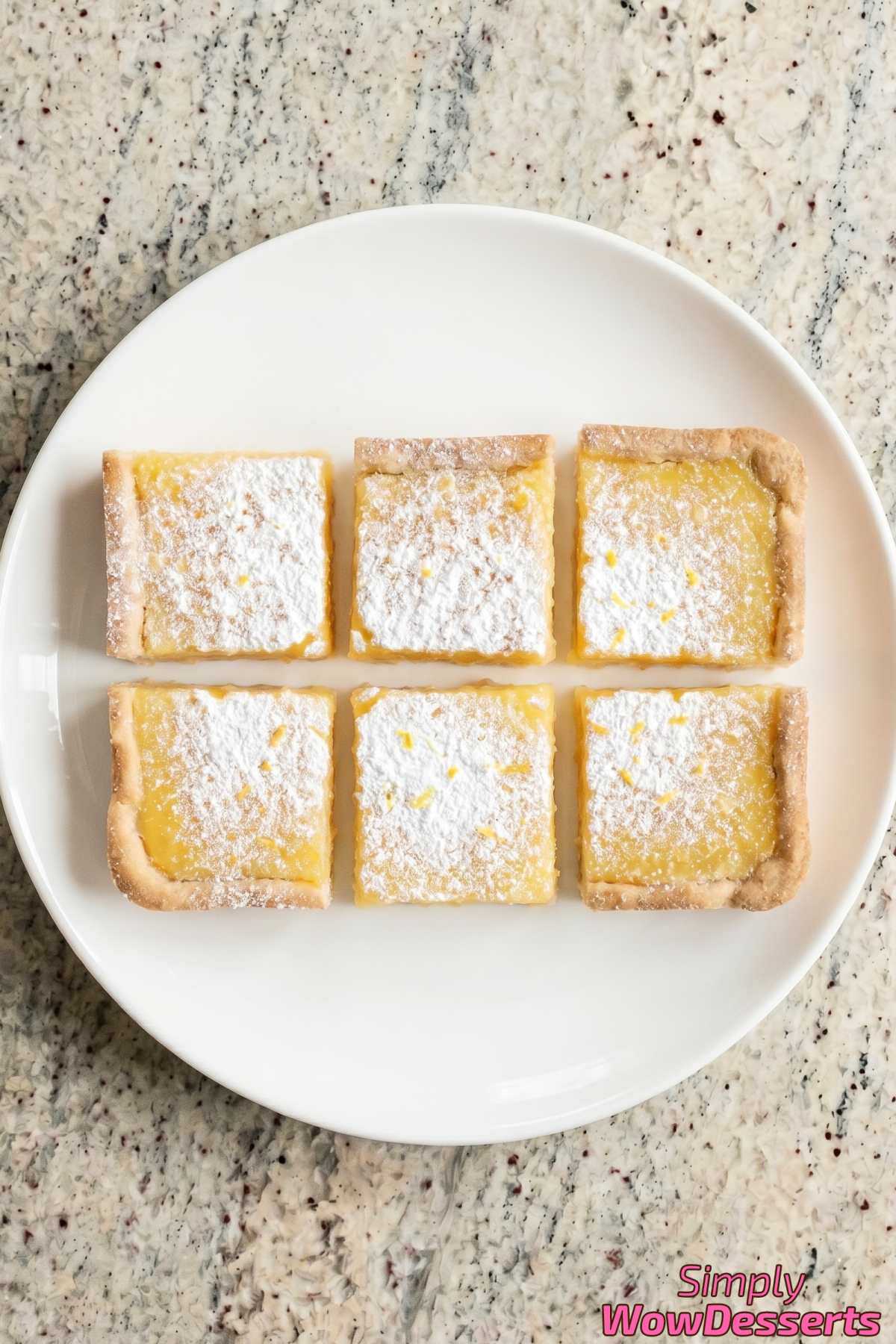 Buttery classic lemon bars with powdered sugar