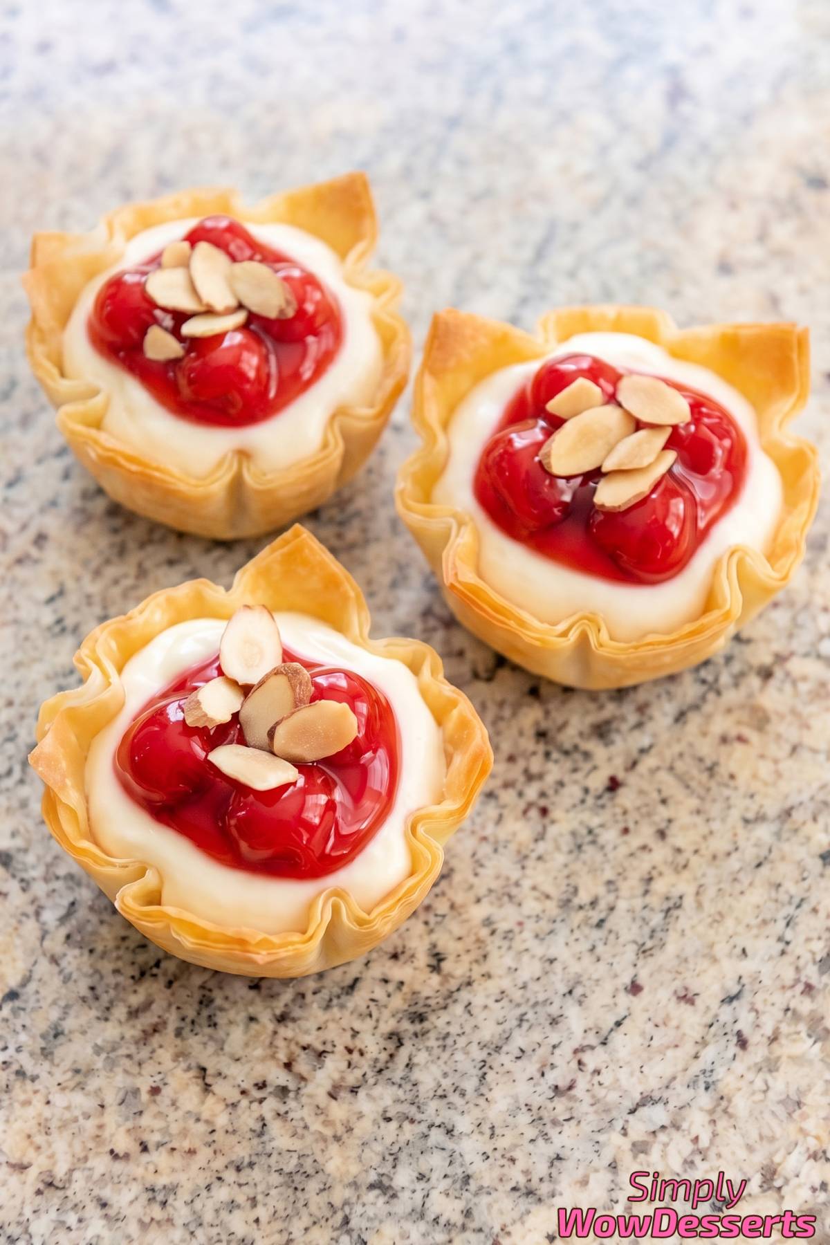 Creamy cheesecake cups with cherry topping