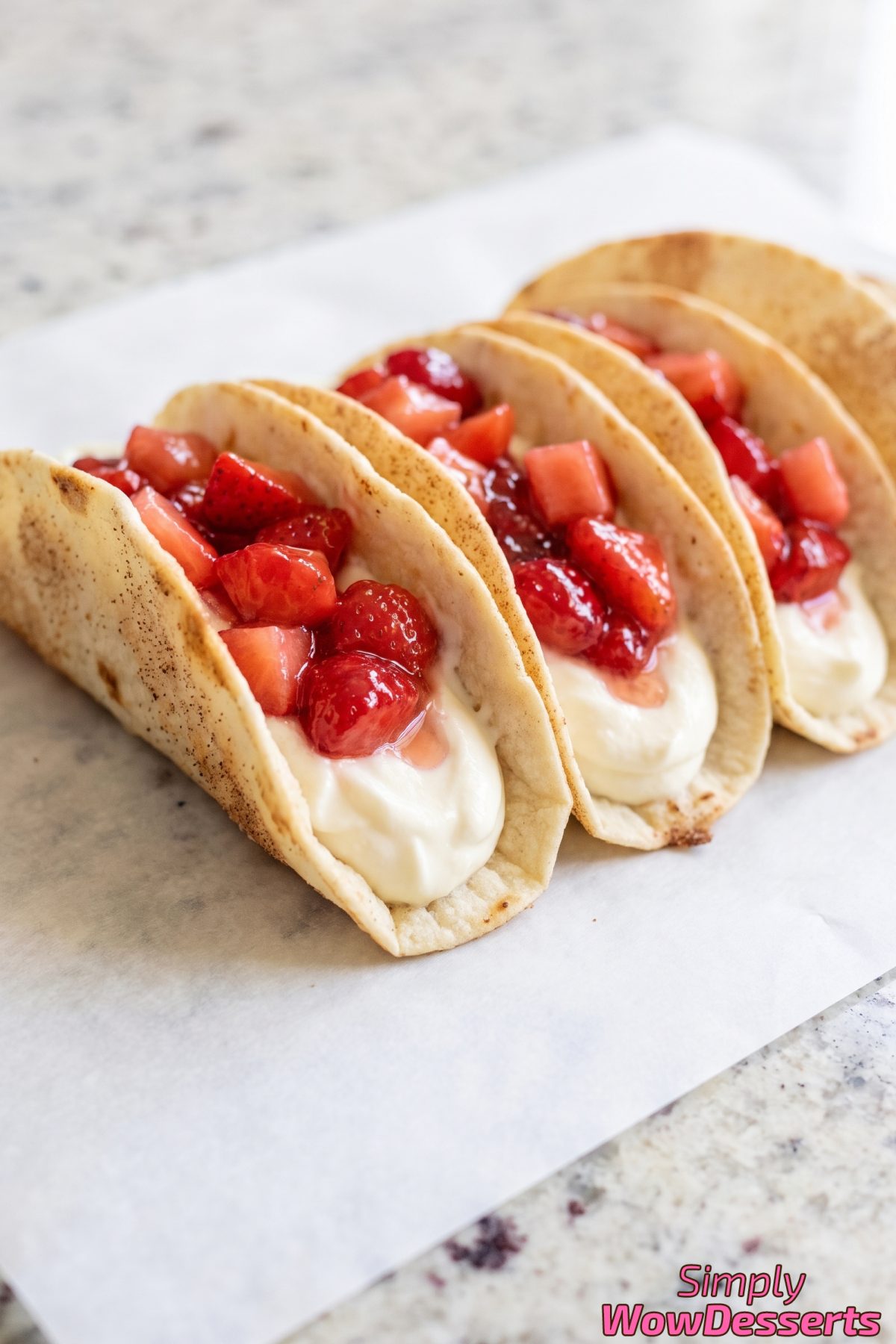 Creamy cheesecake tacos with strawberries