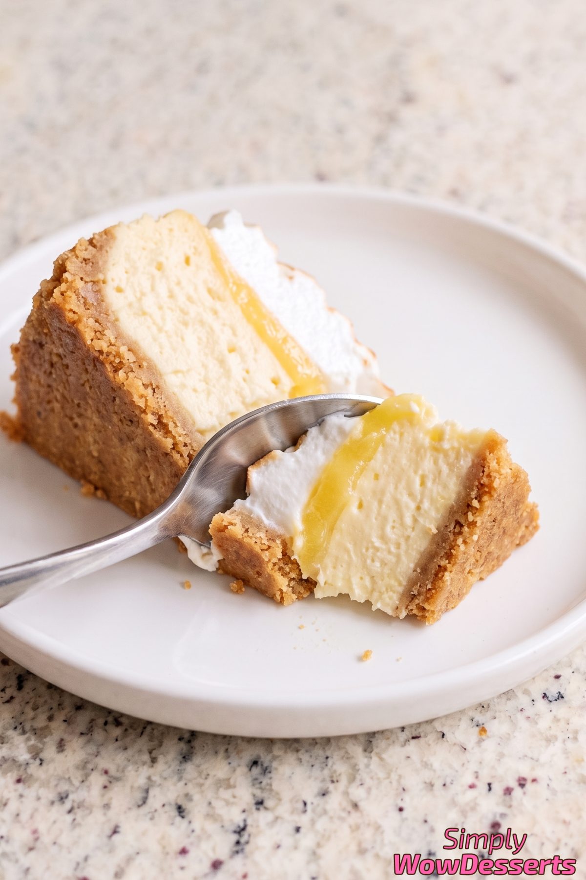 Fluffy meringue topped lemon cheesecake