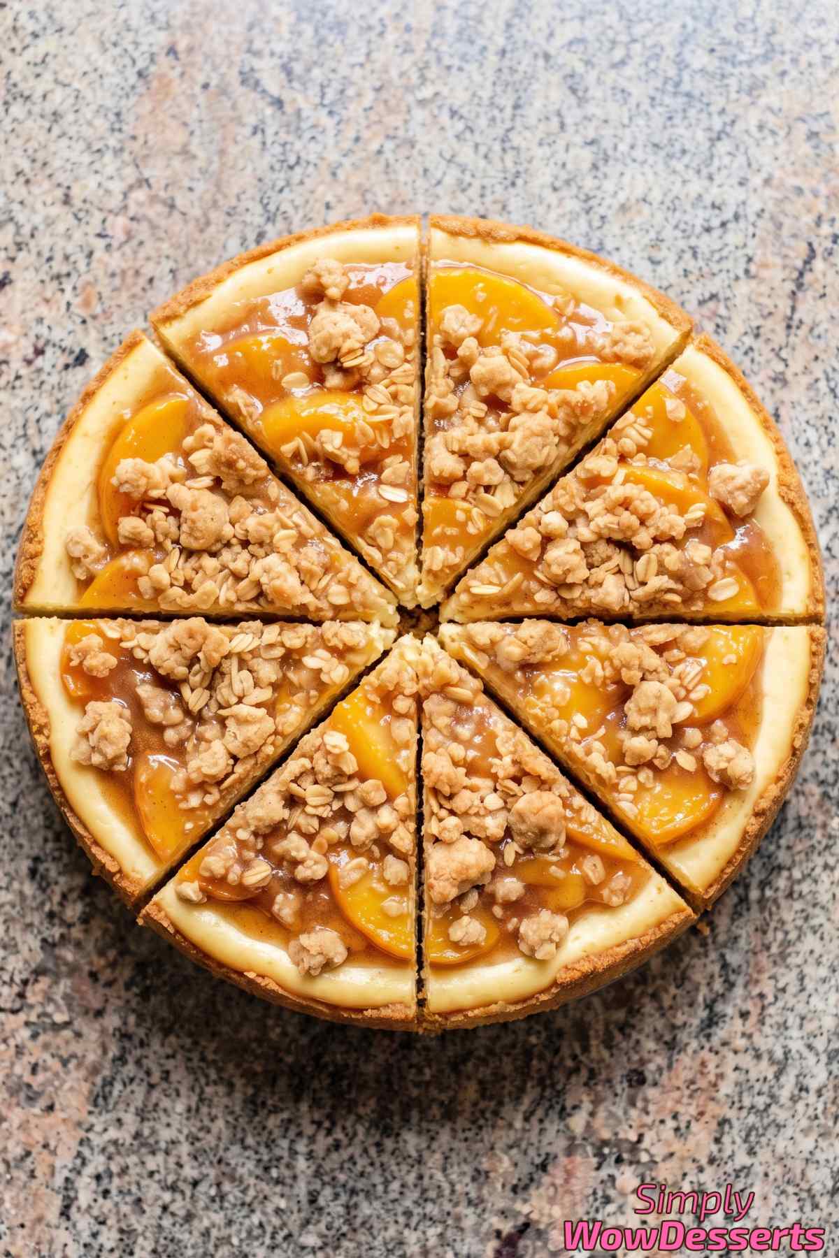 Peach cobbler cheesecake slice on a plate
